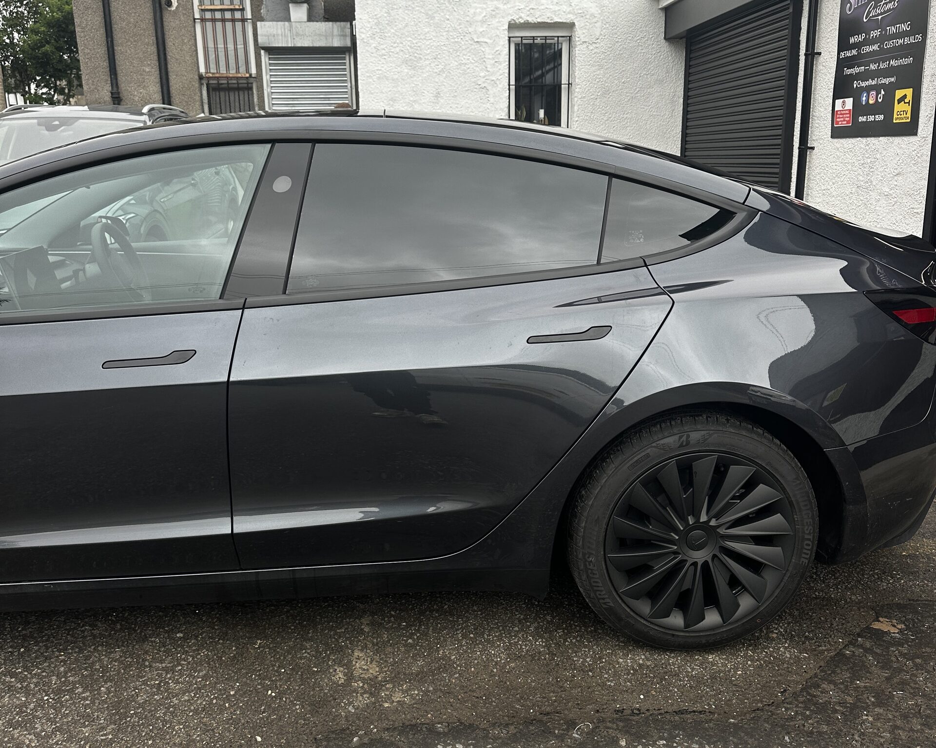 Tesla with 5% rear window tint installed by ShineWorks Customs